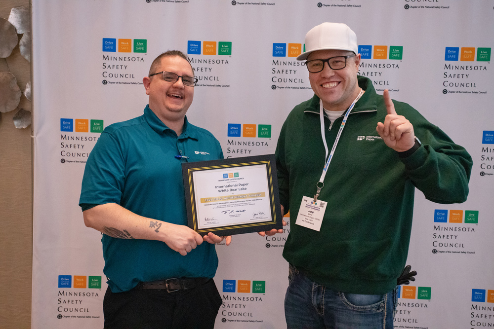 photo of 2 employees from International Paper with their Governors Safety Award